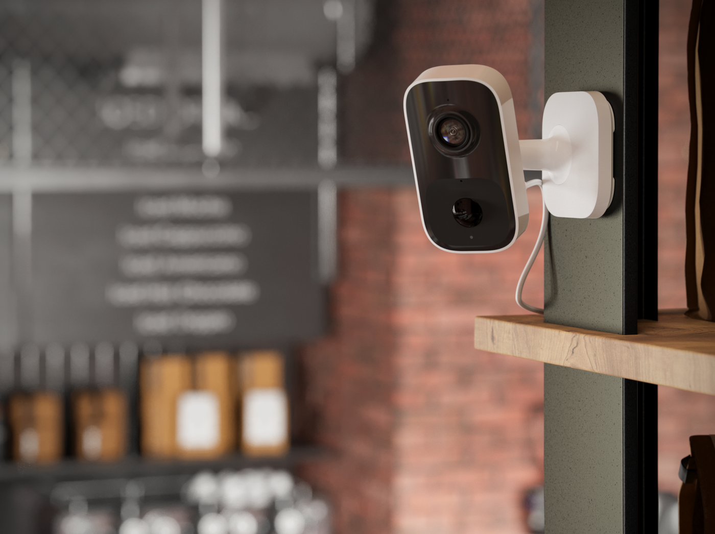 Compact camera mounted on a brick wall inside a cafe